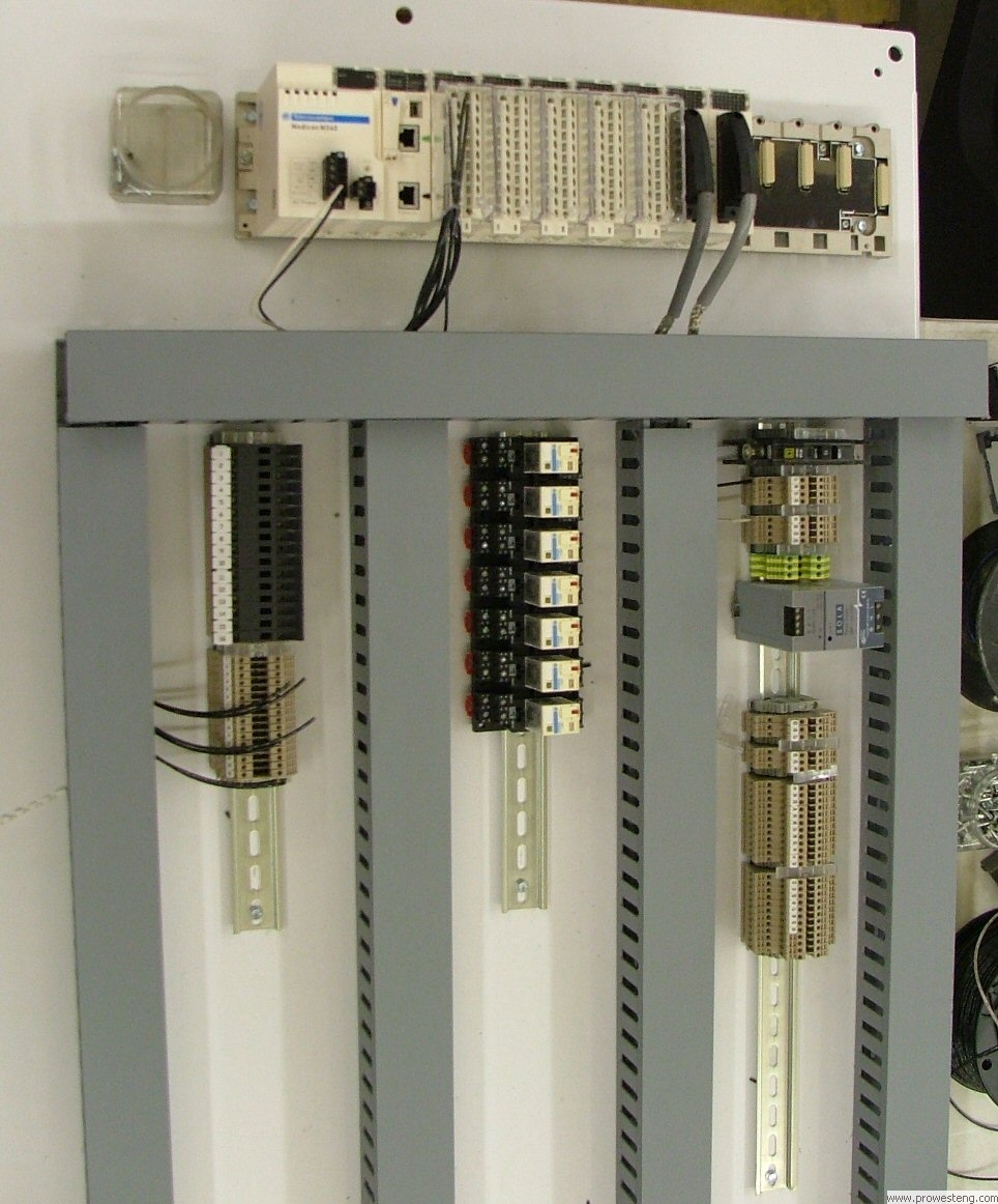 Modicon M340 PLC panel in the assembly process.